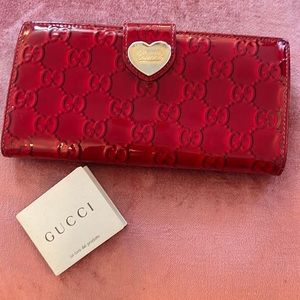 Authentic Gucci red patent leather wallet.
